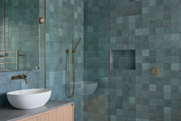 Bathroom in the Dylan Lane family home renovation in Byron Bay, featuring blue tiled walls.